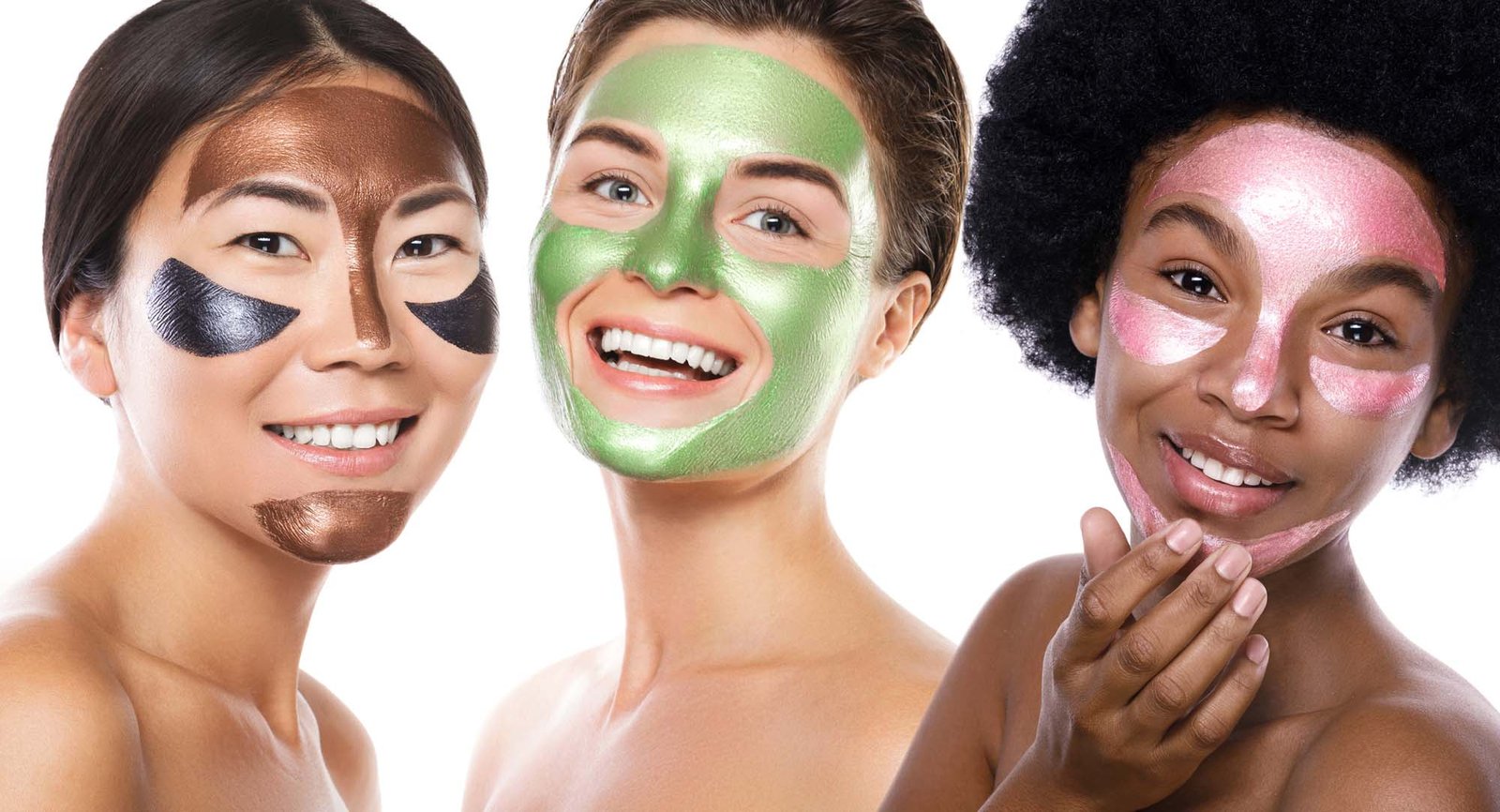 Beautiful multi-ethnic girls with colorful peel-off masks on their faces posing on white background